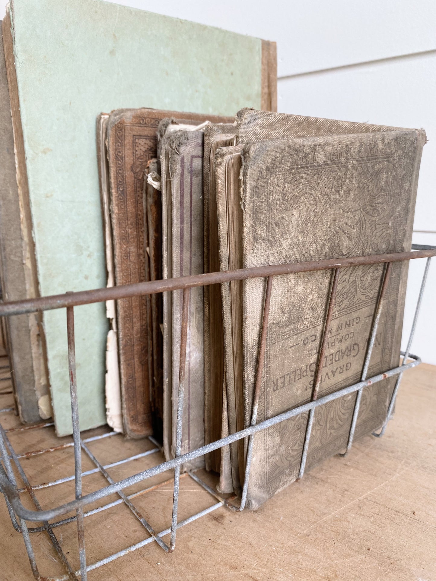 Collection of Vintage & Antique Books in a Vintage Wire Basket